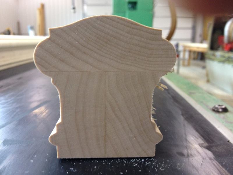 Craftsman finishing a custom maple hand rail — Haselton Lumber mill shop