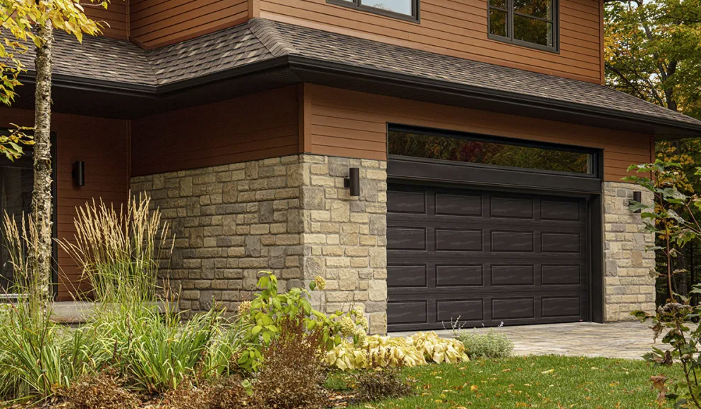 Residential garage door on a finished home exterior